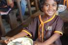 A child in Madagascar enjoys a nutritious daily meal in a school canteen that is supported through Mary’s Meals and its donors.