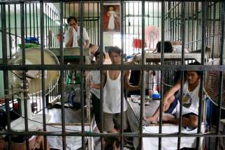 Filipino inmates share a cell at a jail facility in Manila, Philippines, in this April 17, 2006, file photo. Combating radicalization in prisons will be addressed at a May 30-June 1 gathering in Strasbourg, France. 