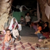 A Libyan family sits in a cave they use for shelter when armed forces loyal to Libyan leader Moammar Gadhafi fired rockets that landed near their home on the outskirts of Zintan, southwest of Tripoli, May 30.