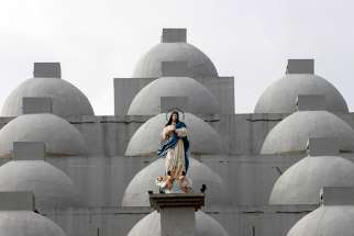 A statue of Mary is seen in 2017 atop the Cathedral of Managua in Nicaragua. A 24-year-old woman dumped sulfuric acid on a priest while he was hearing confessions in the cathedra Dec. 5. 