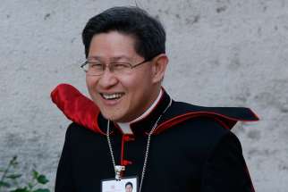 Cardinal Luis Antonio Tagle of Manila, Philippines, arrives for the opening session of the extraordinary Synod of Bishops on the family at the Vatican Oct. 6.