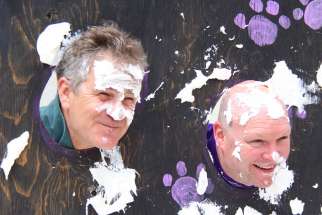On the school’s feast day celebration, St. Joseph school principal Jeff Quinneville, left, and teacher Bo Pryszlak invited students to throw pies at their faces with donations in support of ShareLife.