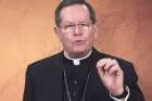 Cardinal Gerald Lacroix of Quebec gestures as he speaks in a video message Jan. 19, 2021. As human and material resources diminish, the cardinal announced the archdiocese will reorganize to focus on reaching out to the population not currently reached by the church&#039;s message.