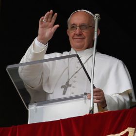 Pope Francis greets the crowd as he arrives to lead the &quot;Regina Coeli&quot; (Queen of Heaven) prayer from the window of the papal apartment overlooking St. Peter&#039;s Square at the Vatican April 1.