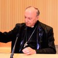 Belgian Archbishop Andre-Joseph Leonard of Mechelen-Brussels reacts after activists from FEMEN threw water at him during a conference at the Free University of Brussels in Belgium April 23. Four bare-breasted protesters disrupted an evening debate and wa ved placards with the slogan, &quot;Stop homophobia.&quot;