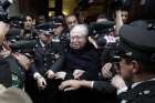 Chilean Father Fernando Karadima leaves after attending a 2015 hearing at the Supreme Court building in Santiago. A Sept. 28 Vatican statement said Pope Francis had expelled Karadima from the priesthood. 