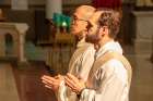 Still wearing their deacons’ stoles, Canadian Jesuits Arthur Suski and Edmund Lo are presented to Archbishop Terry Prendergast for ordination into the priesthood at St. Paul’s Basilica, Toronto, May 19.