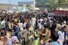 People try to get into Hamid Karzai International Airport in Kabul, Afghanistan, Aug. 16 to flee the Taliban.