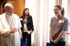 Pope Francis greets Emilie Callan, right, a synod delegate from Canada, during a session of the Synod of Bishops on young people, the faith and vocational discernment at the Vatican Oct. 11.