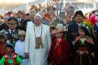 Pope Francis walks with Bolivian President Evo Morales and children in traditional dress as he arrives at El Alto International Airport in La Paz, Bolivia, July 8. The airport is over 4000 metres above sea level.