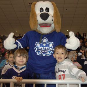 Friends and classmates from North Hill Private School in Vaughan Federico Hjorth (left) and Francisco Dele (right) welcome Duke the Dog into the stands at the Ricoh Coliseum March 7.