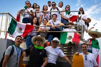 Pilgrims from Mexico pose for a group photo during a tour of the Panama Canal near Panama City Jan. 21, the day before the official opening of World Youth Day in Panama.