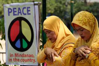 Muslims pray during the &quot;All-Out-Peace&quot; campaign in Manila, Philippines, March 6. Cardinal Orlando Quevedo of the Cotabato Archdiocese, whose population is half Muslim, announced the formation of a separate organization, &quot;Friends of Peace,&quot; April 6 in Manila.