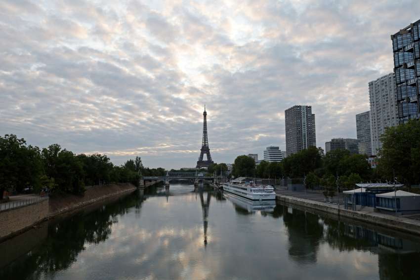 A reflection of the Eiffel Tower is seen in the Seine River in Paris July 25, 2024.