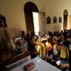 People gather in a church to view the statue of Our Lady of Charity, patron of Cuba, in the village of Arango near Havana earlier this year. Pope Benedict XVI will visit Cuba next year.