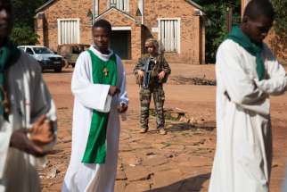  In this July 27, 2014, file photo, a French soldier stands guard at St. Joseph Cathedral in Bambari, Central African Republic.