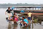 Residents of Dos de Mayo, Peru, wash their clothes in a nearby lake in 2014. Peruvian Archbishop Salvador Pineiro Garcia-Calderon says Pope Francis wants to dedicate a meeting of the Synod of Bishops to the concerns of the indigenous people in the Amazon region.