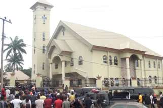 A still image taken from a video shows people gathering outside St. Philip Catholic Church following a deadly shooting by unknown gunmen Aug. 6 in Ozubulu, Nigeria. Pope Francis called for an end to violence against Christians following deadly attacks at St. Philip&#039;s and at a mission in Gambo, Central African Republic.