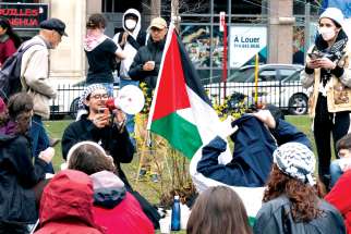 Pro-Palestinian protesters at McGill University, replete with megaphone, keffiyeh, Palestinian flag, and, of course, their iPhones.