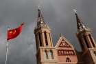 The Chinese national flag flies in front of a Catholic church in the village of Huangtugang, Hebei province, China.