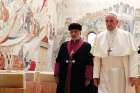 Pope Francis walks with Catholicos Gewargis III, patriarch of the Assyrian Church of the East, during a private audience Nov. 9 at the Vatican. 