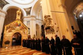  Franciscan friars wait for the arrival of Pope Francis outside the Portiuncola, the small stone chapel inside the Basilica of Santa Maria deli Angeli in Assisi, Italy, in this Oct. 4, 2013, file photo. Pope Francis plans to make a &quot;simple and private&quot; visit to the Portiuncola Aug. 4. The stone chapel was rebuilt by St. Francis.