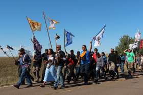 Several hundred people took part in a prayer walk on Sept. 14, 2016, from the Oceti Sakowin camp near Standing Rock Reservation in North Dakota to the site up the road where Dakota Access began digging over Labor Day weekend for construction on a nearly 1,200-mile pipeline project. Construction temporarily has been halted.