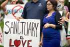  People participate in a rally for immigration reform in National City, Calif., June 6, 2017. 