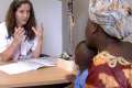 Midwife Mathilde Delespine speaks with a Malian woman at a new women’s centre outside Paris. The woman is afraid her child will be excised, as she was.