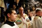 Archbishop Pierbattista Pizzaballa, apostolic administrator of the Latin Patriarchate of Jerusalem, prays in the Grotto during a Christmas Mass at the Church of the Nativity in the West Bank town of Bethlehem.