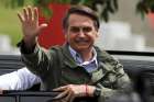 Newly elected Brazilian President Jair Bolsonaro, a Catholic, waves Oct. 28 at a polling station in Rio de Janeiro.