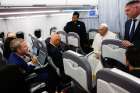 Pope Francis listens to a question from a journalist aboard his flight back to Rome from Marseille, France, in this file photo from Sept. 23, 2023. After not traveling outside Italy for 11 months, the pope is scheduled to visit Indonesia, Papua New Guinea, Timor-Leste and Singapore during a Sept. 2-13 trip.