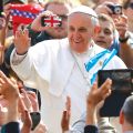 An Argentine flag waves in front of Pope Francis as he greets the crowd as he arrives to lead his general audience in St. Peter’s Square at the Vatican April 17.