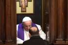 Pope Francis hears confession during his annual Lenten meeting with the pastors of Rome parishes Feb. 15.