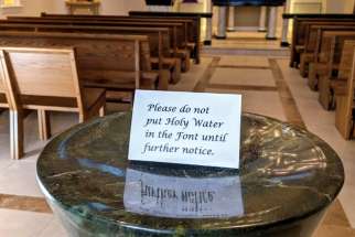 An empty holy water font at the John Paul II Pastoral Centre in Vancouver. Parishes in the Archdiocese of Vancouver have begun cancelling events in response to the coronavirus outbreak.