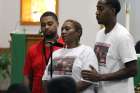 Vivian Carr and her sons Kenneth Johnston and Ellis Carr speak during a Sept. 23 prayer service at Our Lady of Consolation Catholic Church in Charlotte, N.C. The previous day Vivian&#039;s other son, Justin Carr, died from a gunshot wound to the head that he received during protests in Charlotte which turned violent following the fatal police shooting of an African-American man.