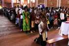 A man kneels in prayer during Mass at St. Famille Church in Kigali April 6, one day ahead of the commemoration of the 20th anniversary of the Rwandan genocide. An estimated 1 million people were murdered in acts of ethnic violence.