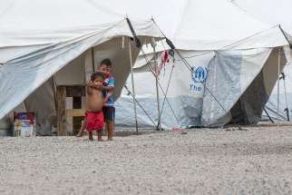 Kids play among the refugee tents at Abrigo One in Boa Vista, Brazil, Feb. 18. 