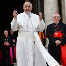 Pope Francis greets the crowd outside after praying the rosary at the Basilica of St. Mary Major in Rome May 4. The pope led the crowd in chanting &quot;Viva la Madonna&quot; (Long live the mother of God). At right is Cardinal Agostino Vallini, papal vicar for Rome.