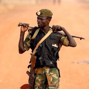 A South Sudan soldier walks on the front line in Panakuach April 24. Recent aerial bombardments, ground-force skirmishes and especially the increasingly hostile rhetoric of the leaders of Sudan and South Sudan have religious leaders worried about the pos sibility of all-out war. 