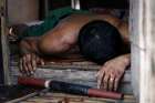 The body of an alleged drug user who was killed during a police operation lies outside a shanty Sept. 12 in Manila, Philippines. The Archdiocese of Manila officially launched a drug rehabilitation program Oct. 23, with a heavy emphasis on spiritual formation in the wake of the Philippine government&#039;s war on drugs.