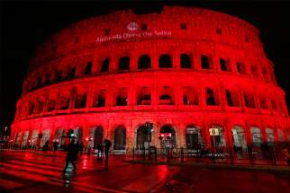 The Colosseum in Rome is lit in red to draw attention to the persecution of Christians around the world. 