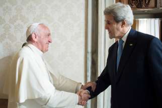 Pope Francis greets U.S. Secretary of State John Kerry during a private meeting at the Vatican Dec. 2.