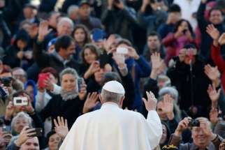 Pope Francis waves as he arrives to lead his weekly audience in St. Peter&#039;s Square at the Vatican Dec. 2