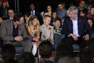 Prime Minister Stephen Harper greets the crowd at the Schwartz/Reisman Community Centre prior to announcing new measures to help make life more affordable for Canadian families.