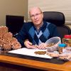 At his Brantford office, Mike Perron works towards rolling one million pennies for charity.