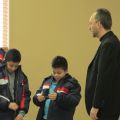 Kids try on winter coats from the Knights of Columbus’ Coats for Kids program in the presence of Fr. Miguel Segura Blay, pastor of Toronto’s Our Lady of Guadalupe parish.