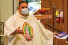 Fr. Peter Ciallella presides at a memorial Mass for Juan Lopez Chaparro last year.