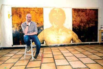 Br. Emmaus O’Herlihy with his painting of Christ the King. The painting is destined for King’s University College in London, Ont., but not before spending time at the University of St. Michael’s College in Toronto.