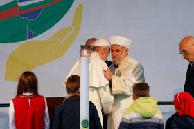 Pope Francis embraces a religious leader during a meeting for peace with Bulgarian representatives of various religious in Nezavisimost Square in Sofia, Bulgaria, May 6, 2019. 